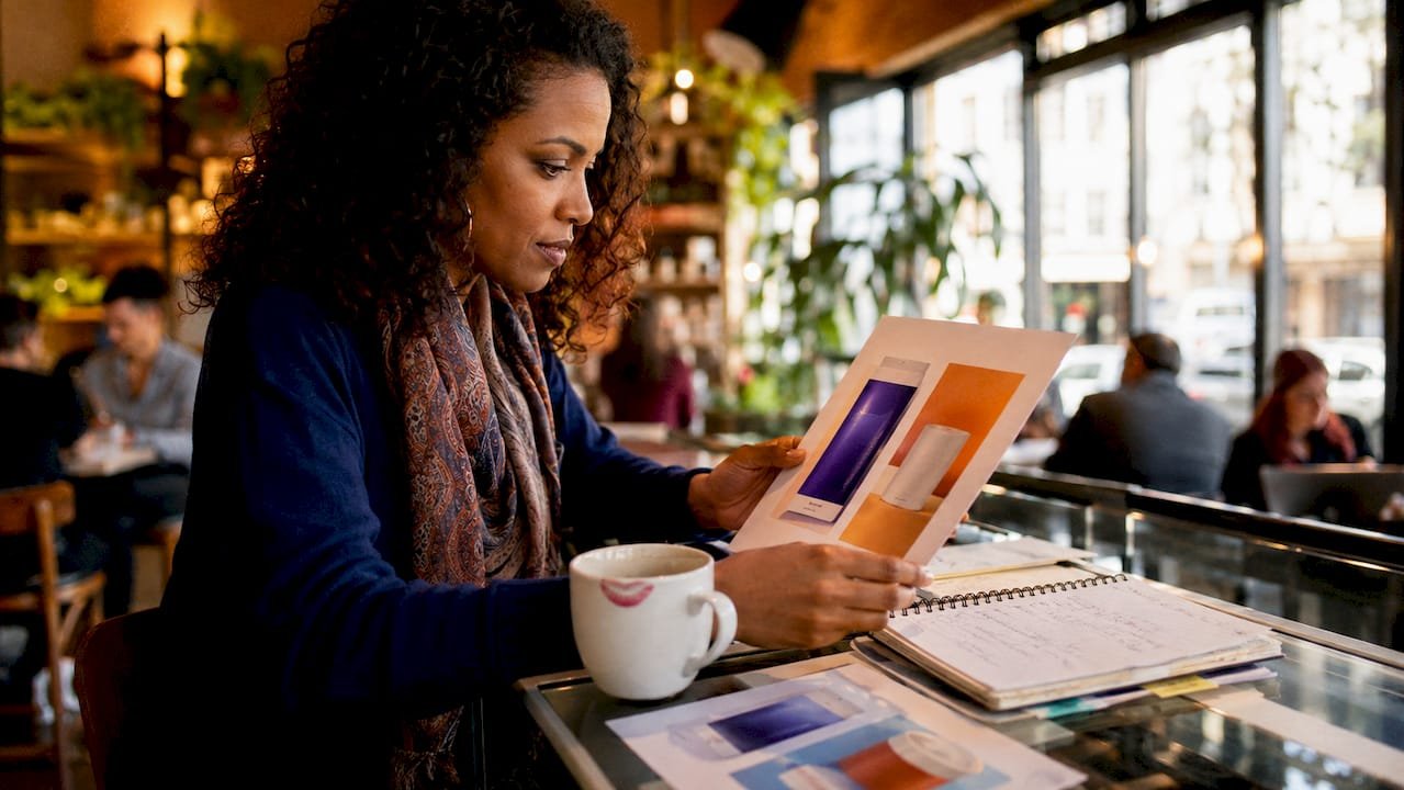 Marketing professional examining co-branded product mockups