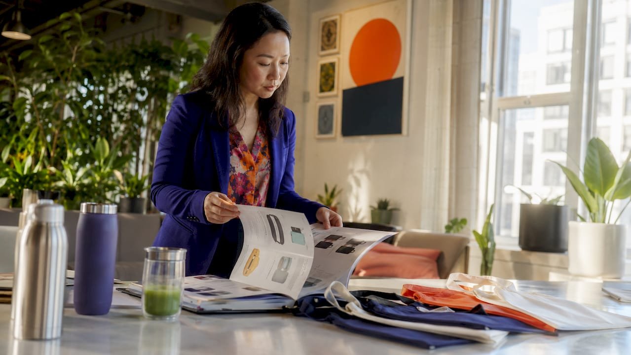 Marketer reviewing branded merchandise catalog