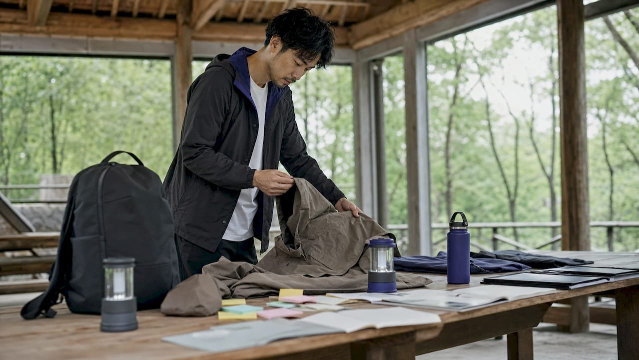Marketer reviewing branded outdoor merchandise samples