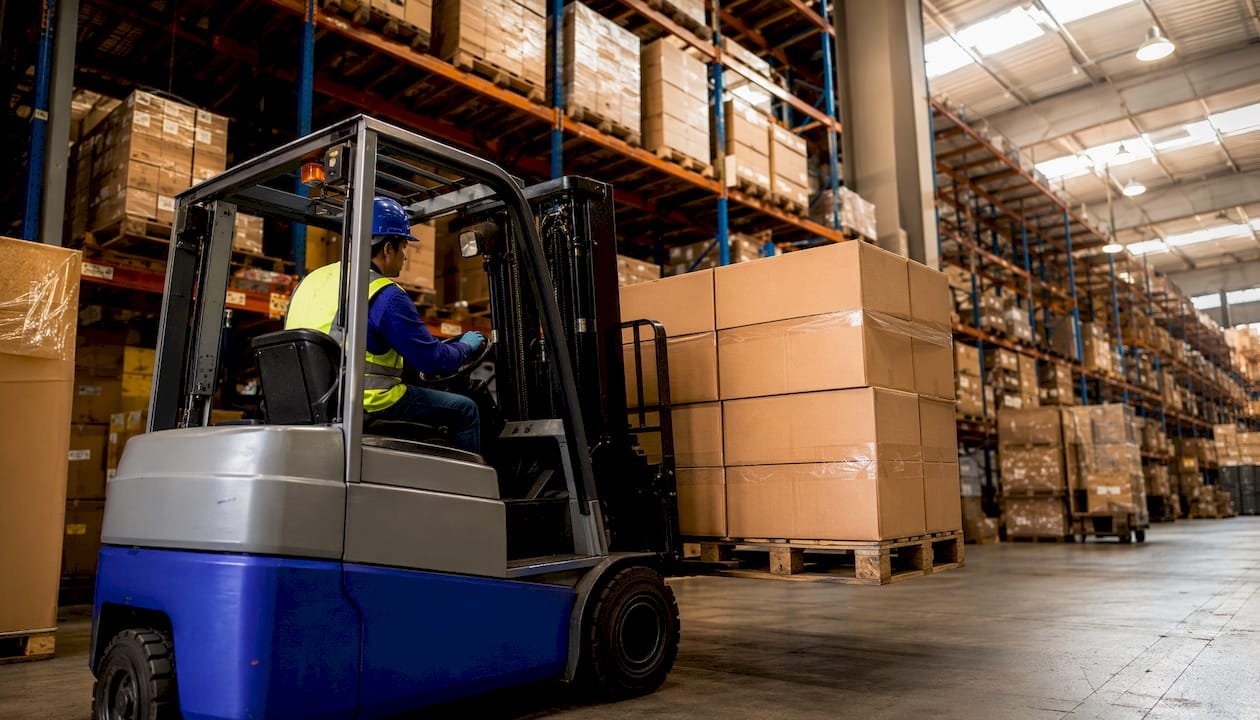 Warehouse with stacked promotional goods boxes