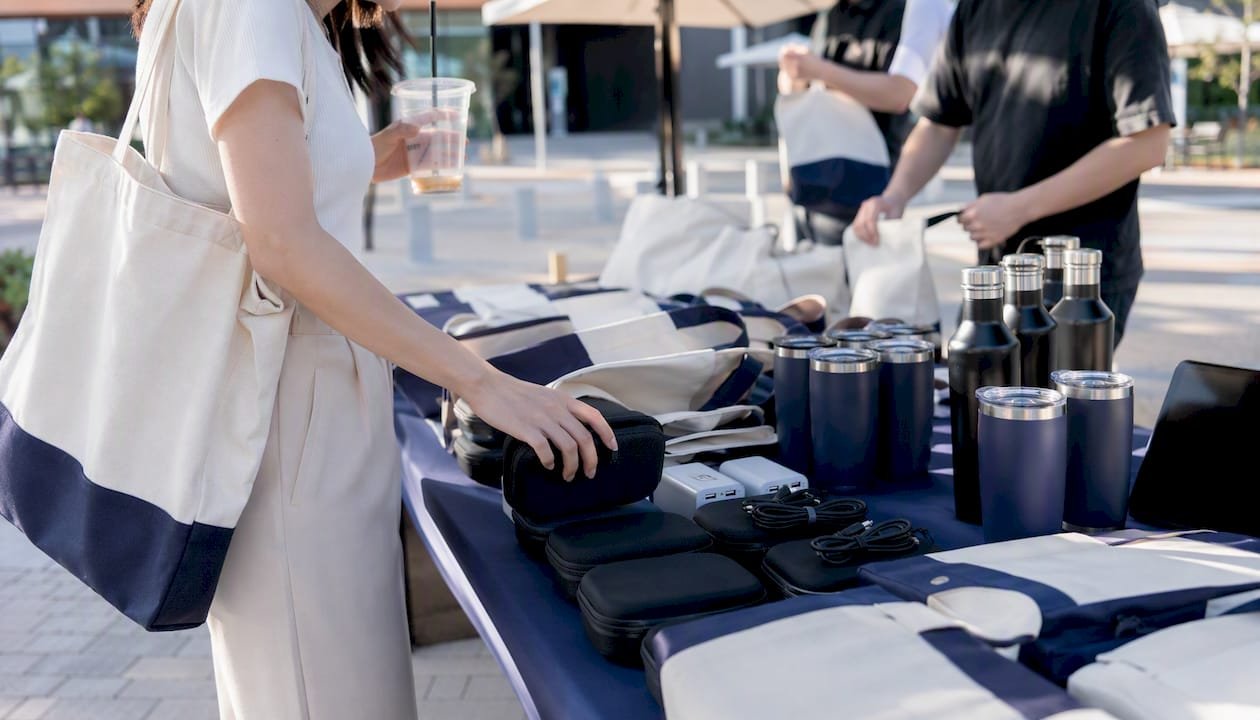 Close-up of recruitment fair giveaway items on booth table