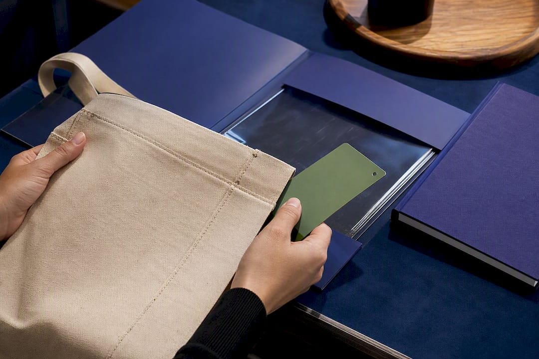 Hands verifying promotional product certification documents