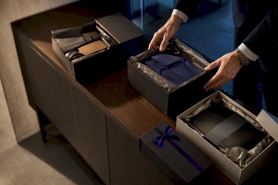 Curated executive gift packages on credenza