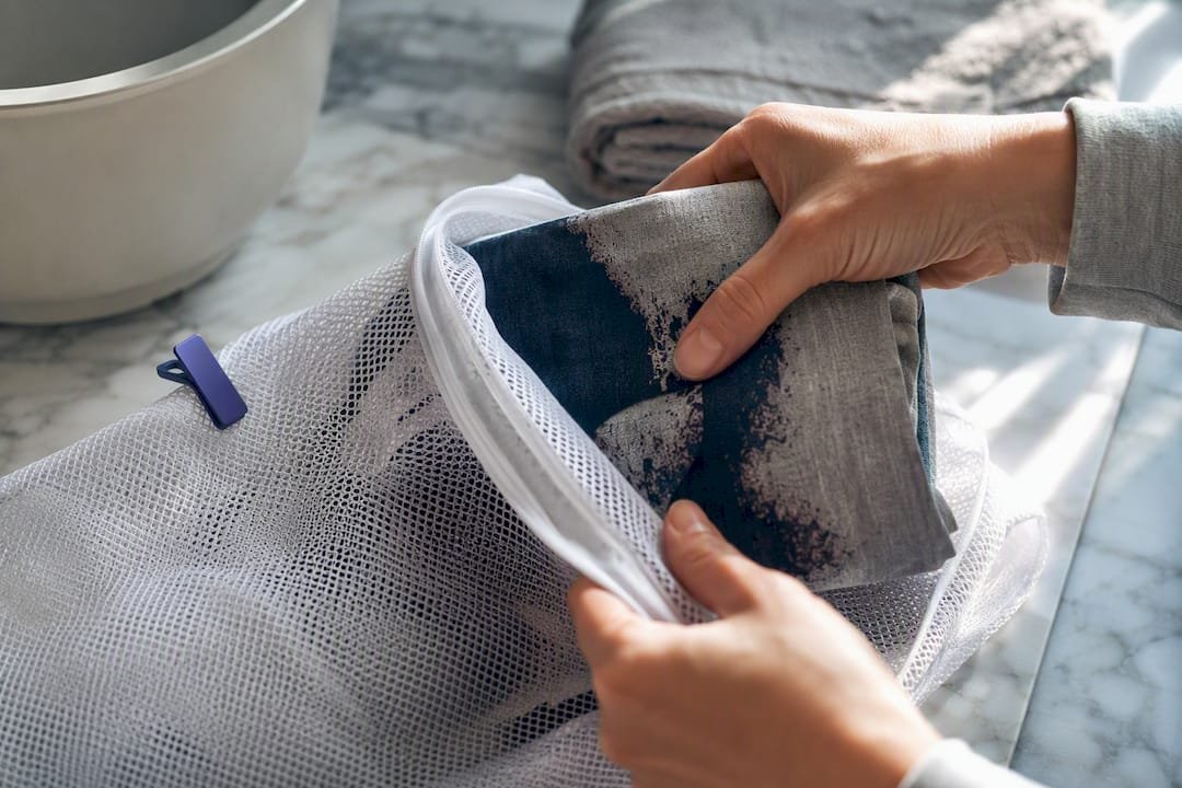 Printed shirt placed inside mesh laundry bag
