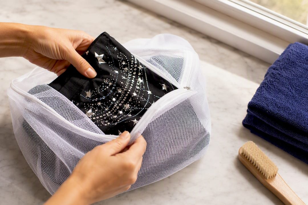 Embellished fabric inside mesh laundry bag